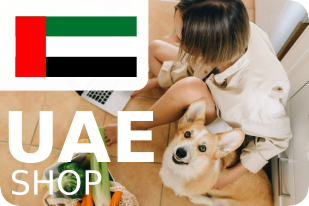 Woman shopping online with her dog an the flag of the UAE on the upper left corner